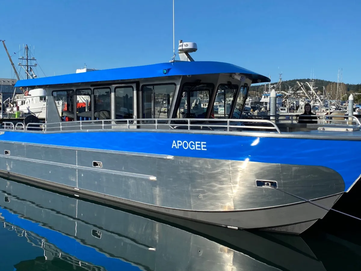 a boat is docked next to a body of water